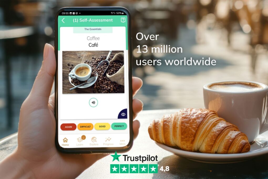 Photo of a hand holding an iPhone with AI language learning app MosaLingua on the screen.